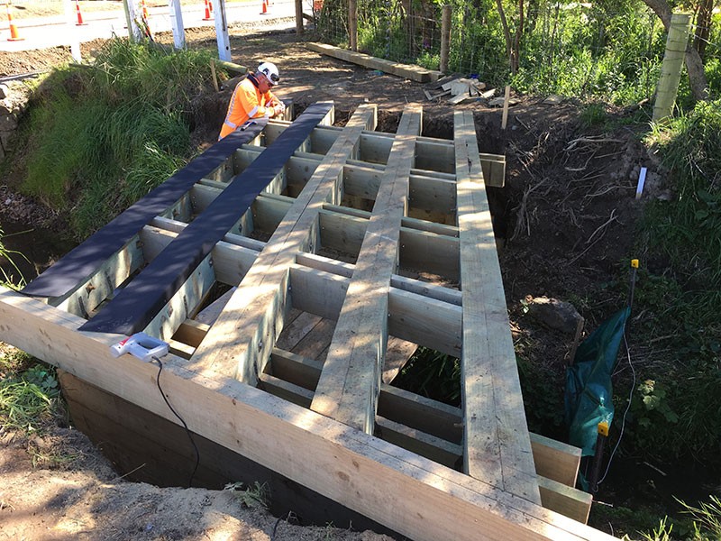 Wairewa Timber bridge beams under construction in Little River Cycle way Canterbury